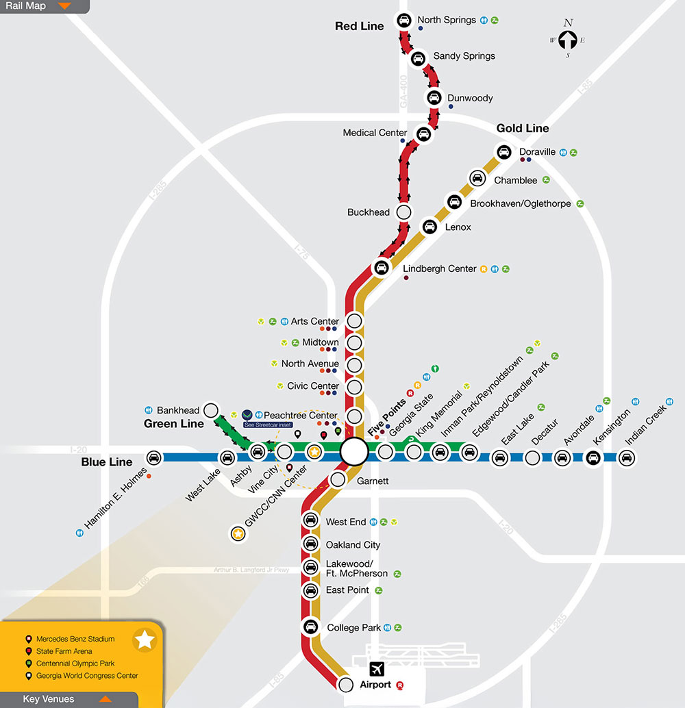 Atlanta transit rail map showing the Red, Gold, Green, and Blue lines with major stations and key venues including Mercedes Benz Stadium, State Farm Arena, Centennial Olympic Park, and Georgia World Congress Center.
